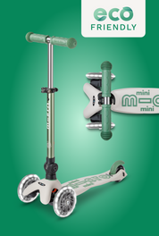 Micro mini scooter with a silver deck and green handlebars on a green background, featuring the 'eco friendly' label.