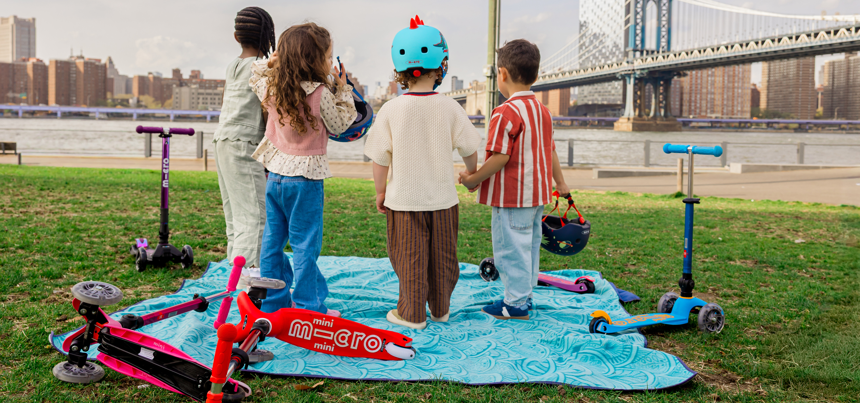 Children with Micro scooters outdoors