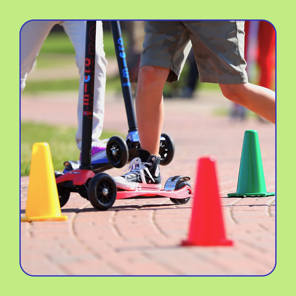 A closeup of the Micro Scooter Cones with children riding around them. 